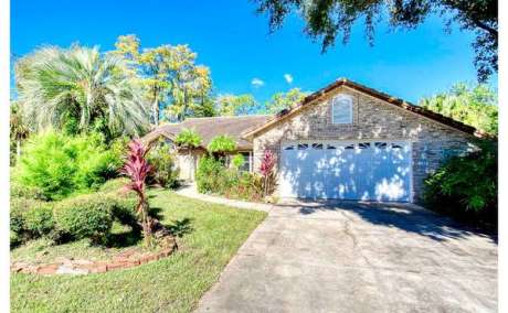 Elegant Custom 3/2 Pool Home in Exclusive Gated Golf Community